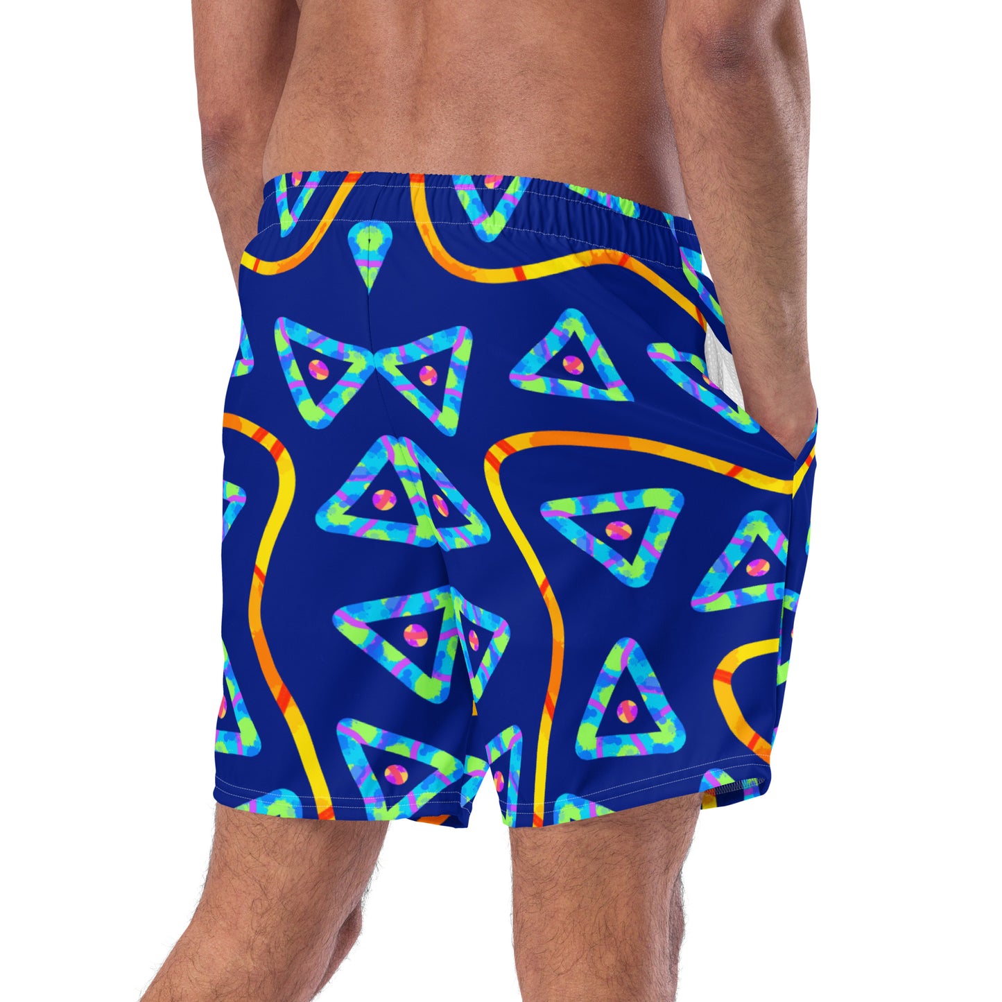 Blue swim shorts with colorful geometric pattern worn by a person on a white background