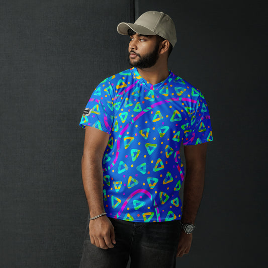 Man wearing a colorful geometric-patterned shirt against a black background